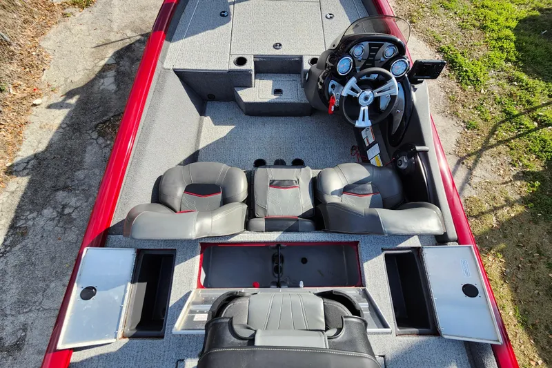 Slide: The Image of 2021 Tracker Pro Team 175 TXW Tournament Edition boat interior with steering console and seating. - 12
