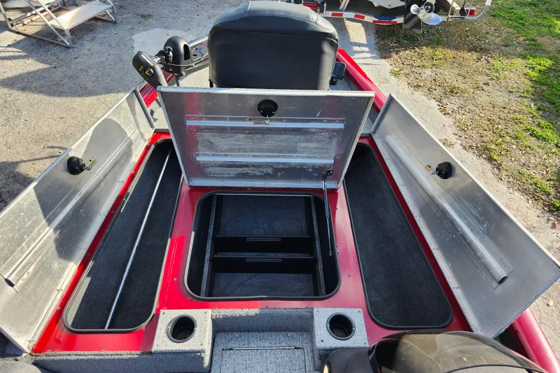 Slide: The Image of 2021 Tracker Pro Team 175 TXW Tournament Edition boat with open storage compartments. - 14