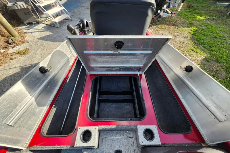 Slide: The Image of 2021 Tracker Pro Team 175 TXW Tournament Edition boat with open storage compartments. - 15