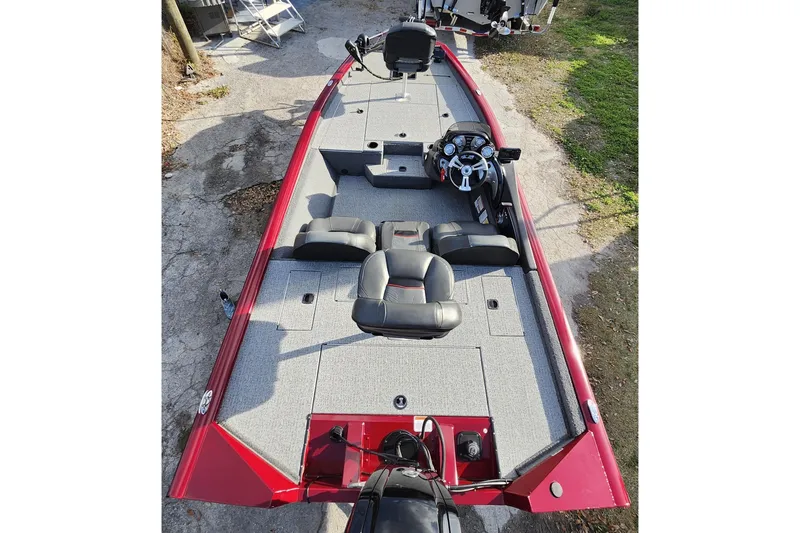 Slide: The Image of 2021 Tracker Pro Team 175 TXW Tournament Edition boat, red exterior, spacious seating, and modern dashboard. - 19