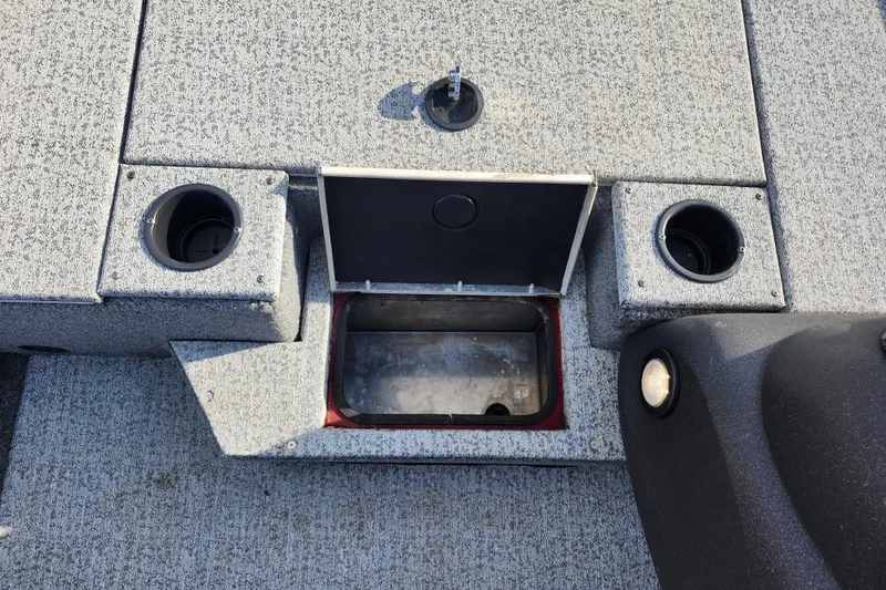 Slide: The Image of 2021 Tracker Pro Team 175 TXW Tournament Edition boat interior with storage compartment and cup holders. - 20