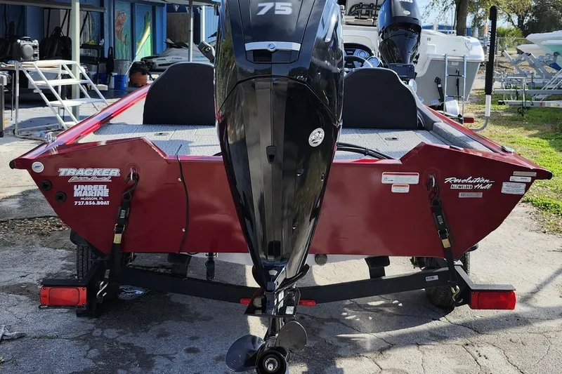 Slide: The Image of 2021 Tracker Pro Team 175 TXW Tournament Edition boat with outboard motor, parked on trailer. - 5