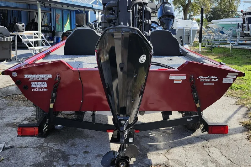 Slide: The Image of 2021 Tracker Pro Team 175 TXW Tournament Edition boat, red, rear view with motor. - 9