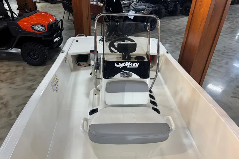 Slide: The Image of 2024 Mako Pro Skiff 15 CC interior view in a showroom. - 5