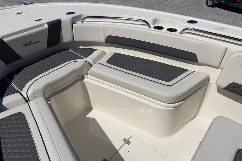 Slide: The Image of Interior seating of 2026 Pioneer 250 Pelagic boat with cushioned upholstery. - 16
