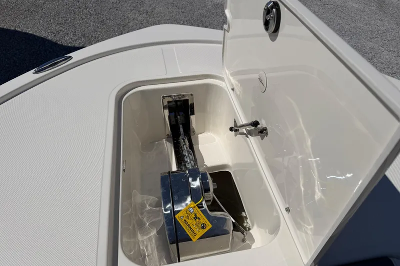 Slide: The Image of Anchor compartment of 2026 Pioneer 250 Pelagic boat, featuring a neatly stored anchor chain. - 18