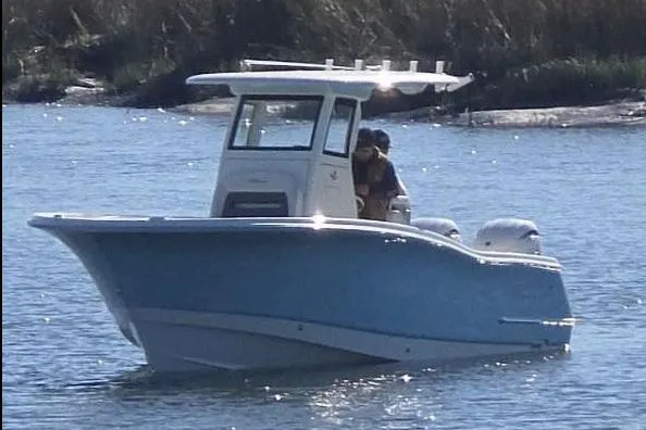 Slide: The Image of Manufacturer Provided Image: 2026 Pioneer 250 Pelagic boat on water, featuring sleek design and dual engines. - 2