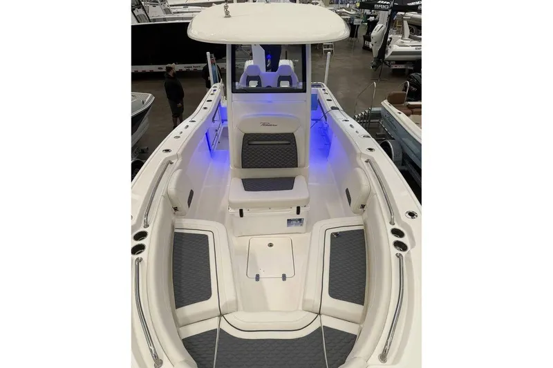 Slide: The Image of 2026 Pioneer 250 Pelagic boat interior with seating and blue accent lighting. - 5
