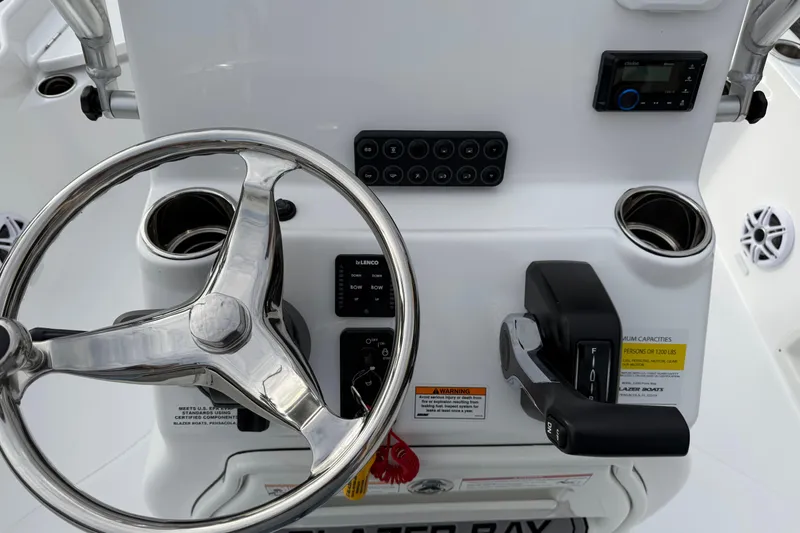 Slide: The Image of 2026 Blazer PureBay 2200 boat console with steering wheel and controls. - 15