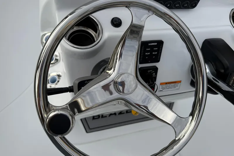 Slide: The Image of Steering wheel of 2026 Blazer PureBay 2200 boat, featuring sleek chrome design. - 21