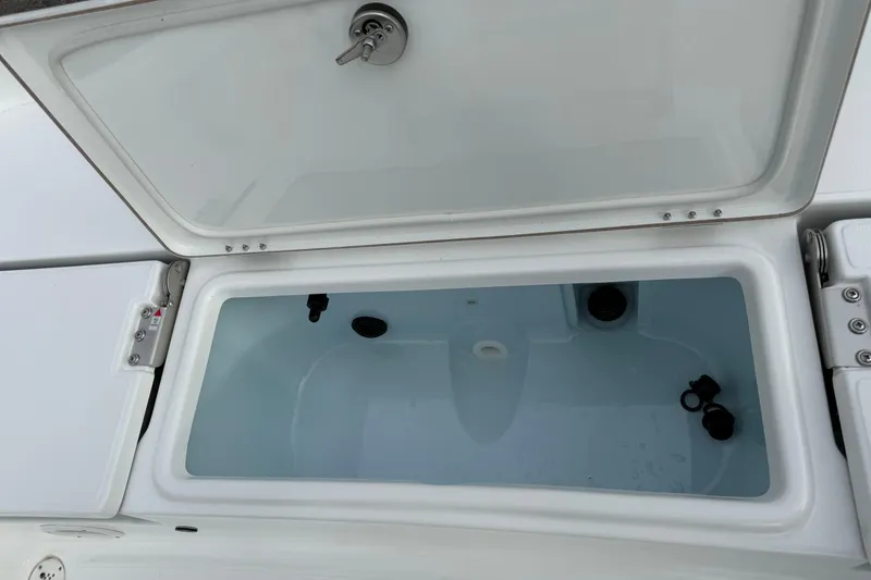 Slide: The Image of Open storage compartment on 2026 Blazer PureBay 2200 boat, showcasing interior features. - 28