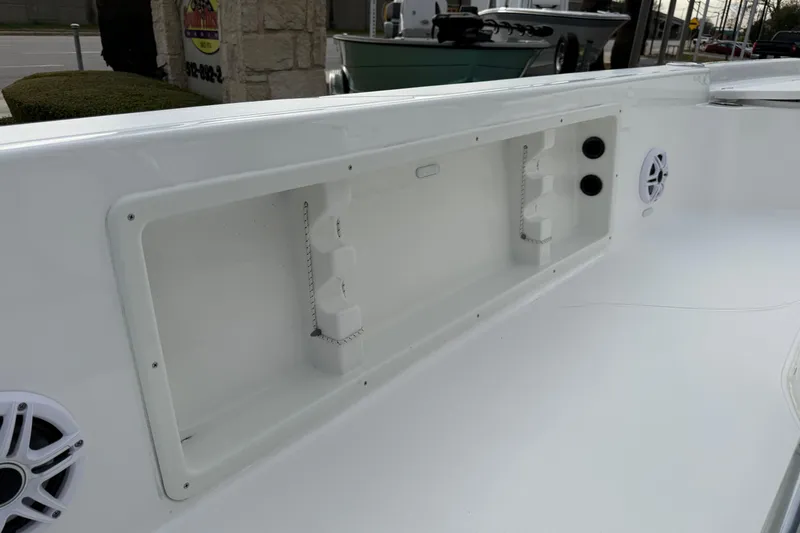 Slide: The Image of 2026 Blazer PureBay 2200 boat interior detail with speaker and storage compartment. - 31