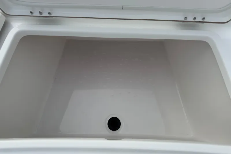 Slide: The Image of 2026 Blazer PureBay 2200 boat storage compartment, open and empty. - 35