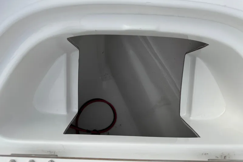 Slide: The Image of 2026 Blazer PureBay 2200 boat compartment with visible wiring. - 37