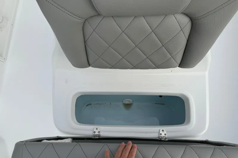 Slide: The Image of 2026 Blazer PureBay 2200 boat seat with storage compartment, featuring quilted gray upholstery. - 43