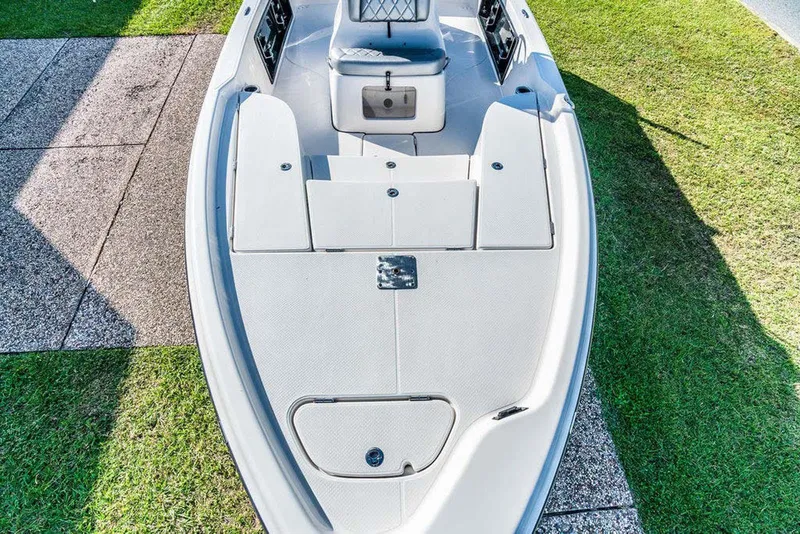 Slide: The Image of Manufacturer Provided Image: 2026 Blazer PureBay 2200 boat on grass, showcasing sleek deck design. - 46