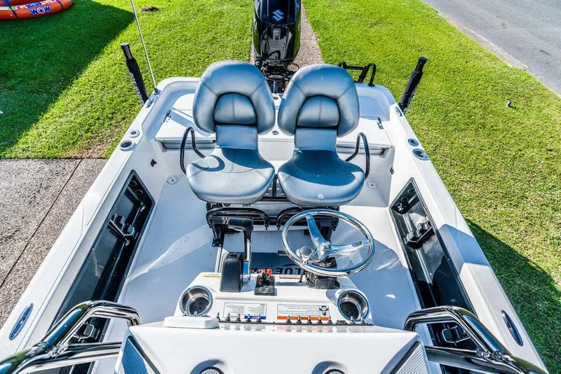 Slide: The Image of Manufacturer Provided Image: 2026 Blazer PureBay 2200 boat interior with dual seats and steering wheel. - 48