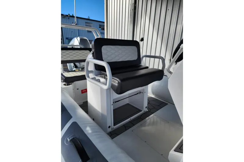 Slide: The Image of 2026 Highfield Sport 560 boat interior with cushioned seating and modern design. - 9