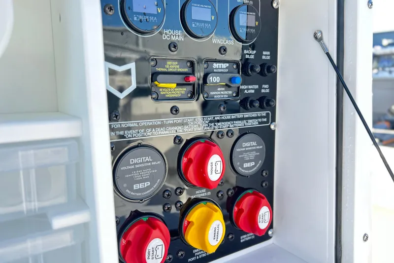 Slide: The Image of Control panel of 2026 Sea Fox 288 Commander boat with switches and circuit breakers. - 13