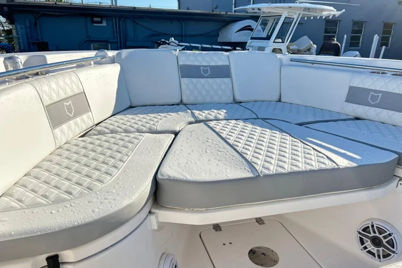 Slide: The Image of Luxurious seating on 2026 Sea Fox 288 Commander boat, featuring quilted upholstery and modern design. - 16