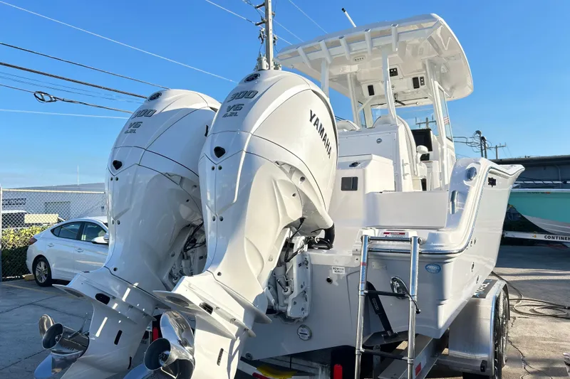 Slide: The Image of 2026 Sea Fox 288 Commander boat with dual Yamaha 300 V6 engines on trailer. - 22