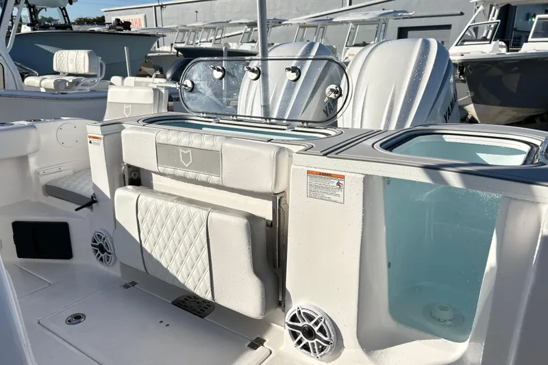 Slide: The Image of 2026 Sea Fox 288 Commander boat interior with seating and storage compartments. - 8