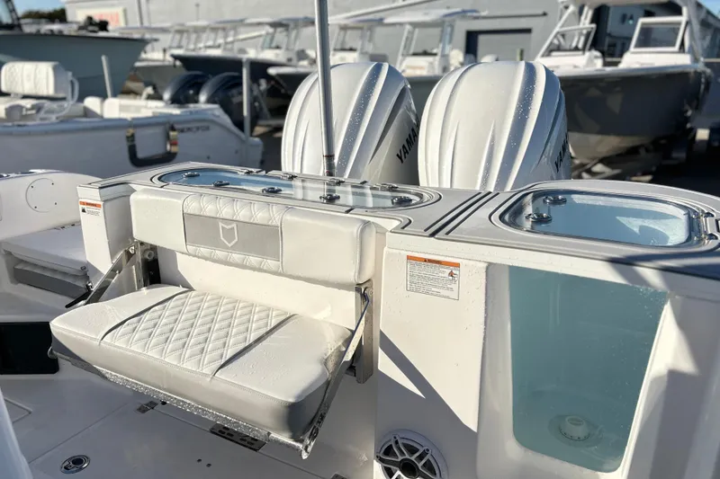 Slide: The Image of 2026 Sea Fox 288 Commander boat with dual Yamaha engines and foldable seating. - 9