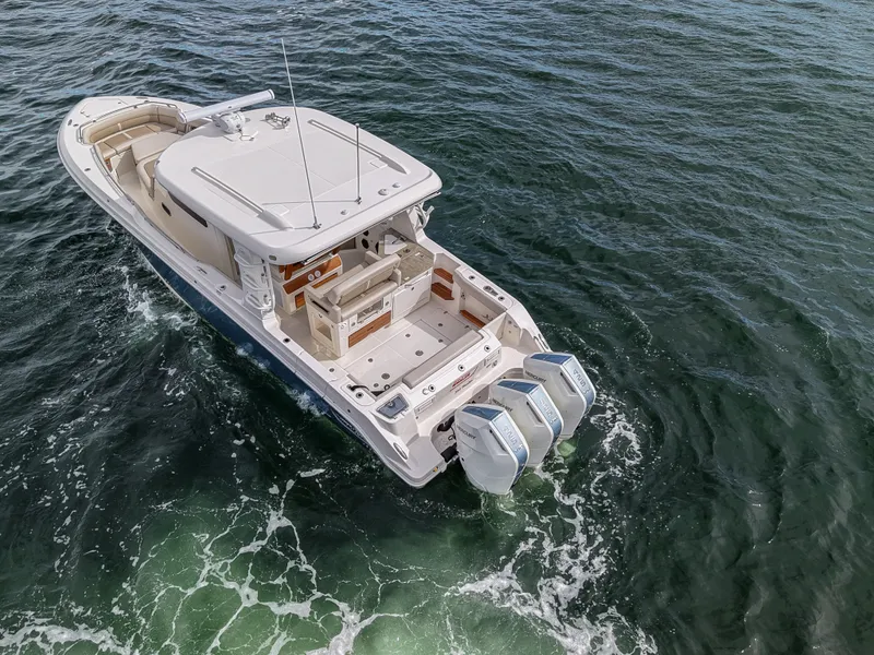 Slide: The Image of Scout 288 Dorado 2027: Sleek design, triple outboard engines, spacious deck, perfect for leisure activities on the water. - 5