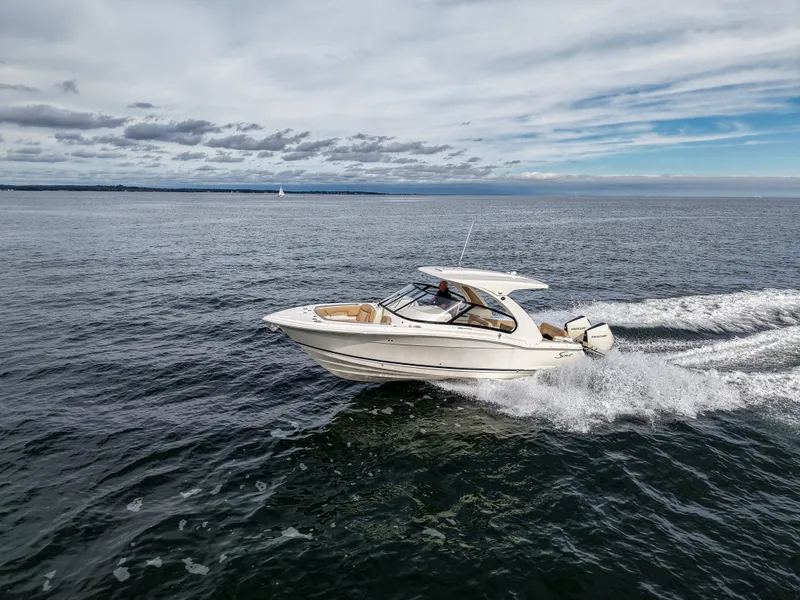 Slide: The Image of 2027 Scout 288 Dorado cruising on open water. - 10