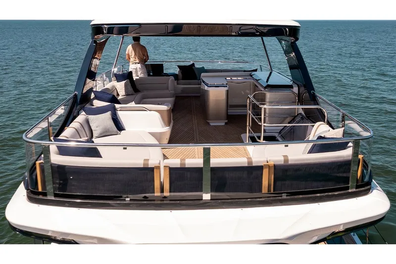 Slide: The Image of Manufacturer Provided Image: Luxurious 2025 Galeon 620 FLY yacht with spacious deck and elegant seating on open water. - 6