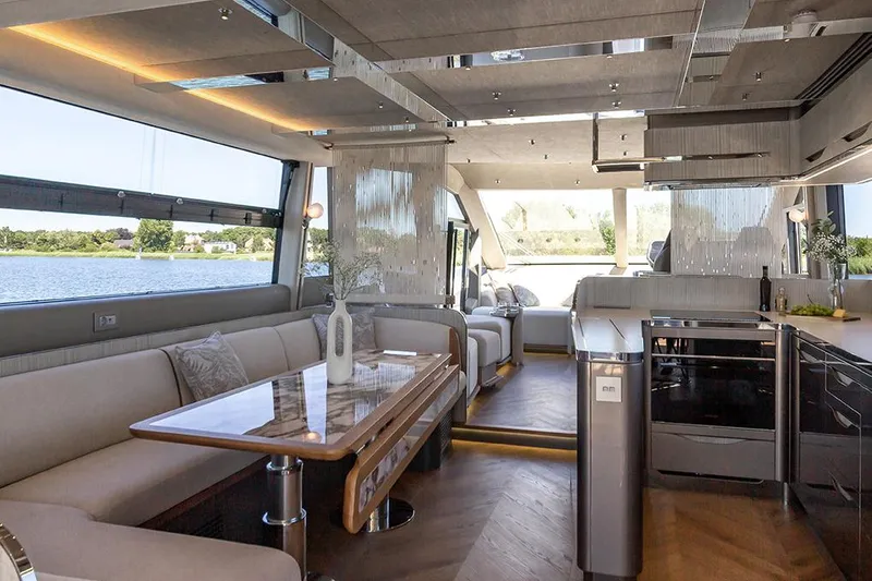 Slide: The Image of Manufacturer Provided Image: Luxurious interior of 2025 Galeon 620 FLY yacht with modern design and scenic water view. - 9