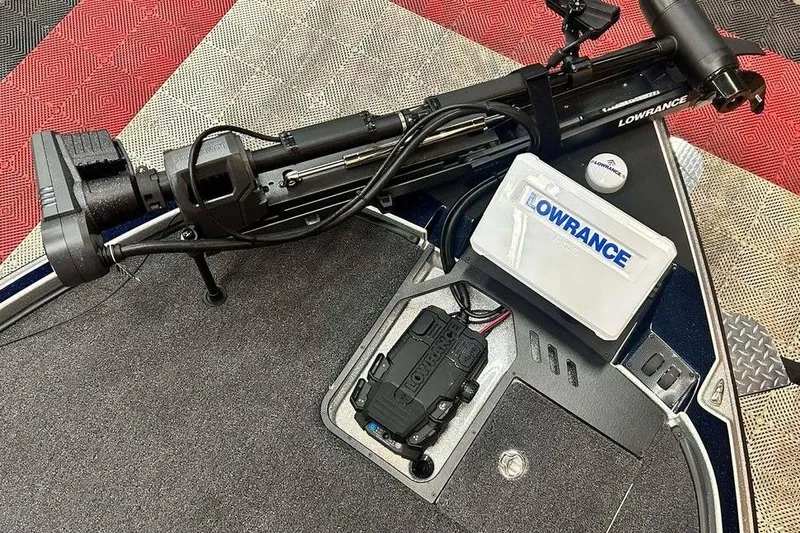 Slide: The Image of Triton 21XP Patriot 2026 boat with Lowrance equipment on deck. - 10