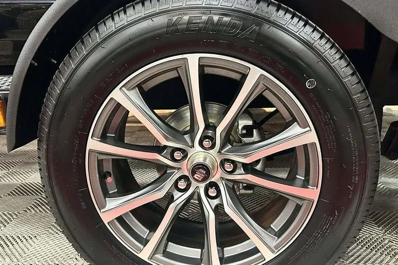 Slide: The Image of Triton 21XP Patriot 2026 model wheel with Kenda tire on display. - 13