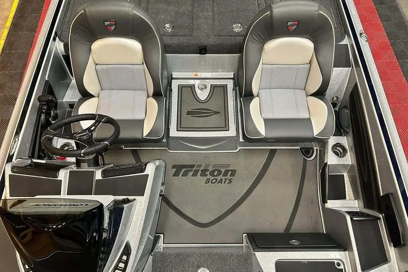 Slide: The Image of 2026 Triton 21XP Patriot boat interior with dual seats and steering console. - 8