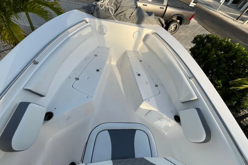 Slide: The Image of 2017 Tidewater 230 CC Adventure boat interior with seating and storage compartments. - 18
