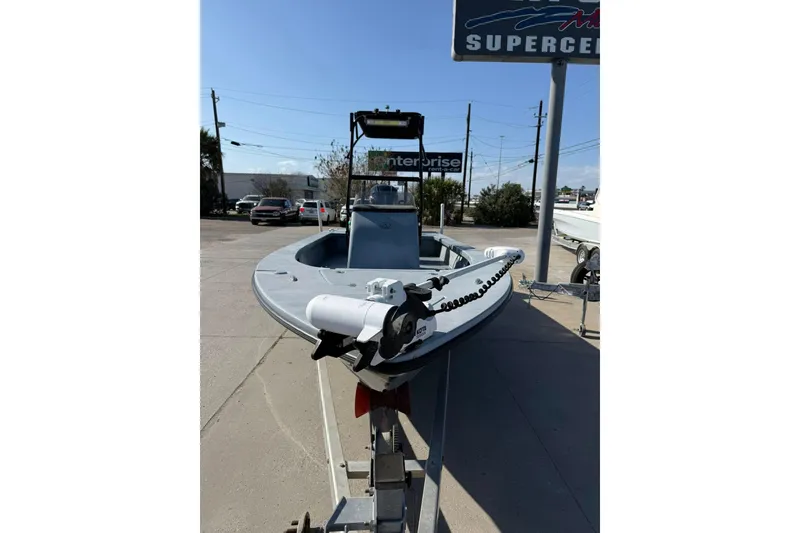 Slide: The Image of 2018 Blazer Bay 2420 GTS boat on trailer at dealership under clear sky. - 11