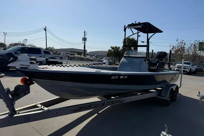 Slide: The Image of 2018 Blazer Bay 2420 GTS boat on trailer, parked outdoors under clear sky. - 13