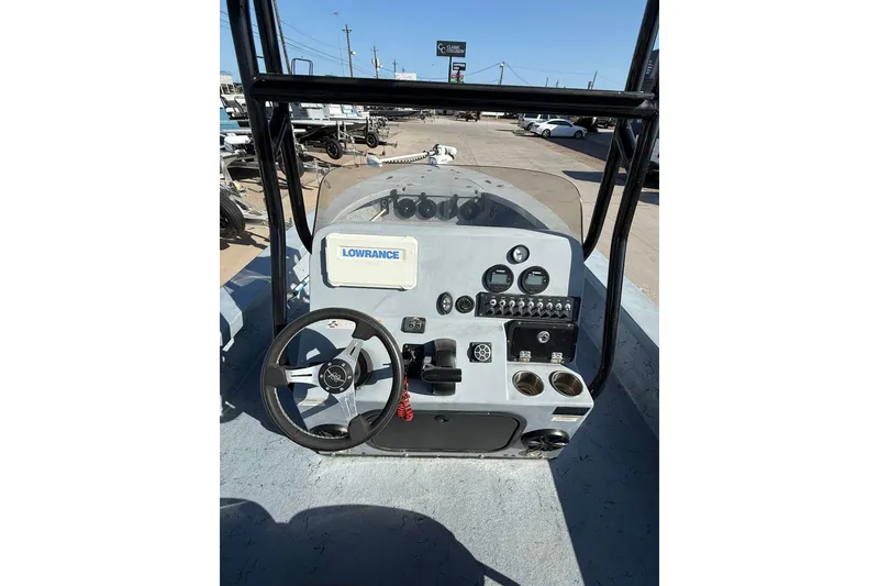 Slide: The Image of 2018 Blazer Bay 2420 GTS boat dashboard with steering wheel and control panel. - 18