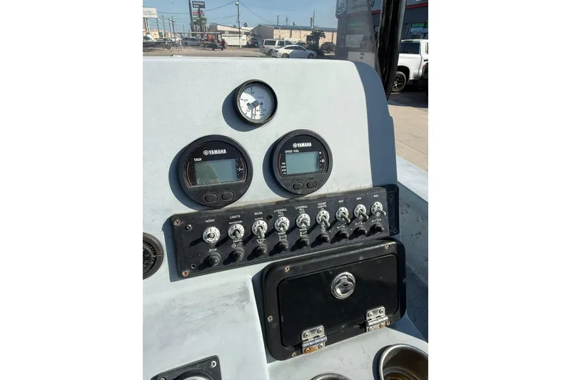 Slide: The Image of 2018 Blazer Bay 2420 GTS boat dashboard with Yamaha gauges and control panel. - 4
