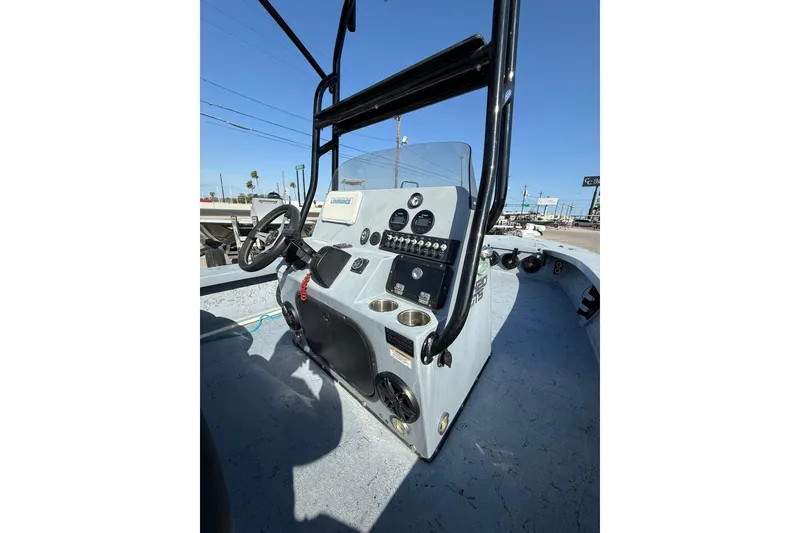 Slide: The Image of 2018 Blazer Bay 2420 GTS boat console with steering wheel and controls. - 5