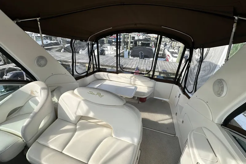 Slide: The Image of Interior of 2002 Sea Ray 340 Sundancer yacht with white seating and table. - 19