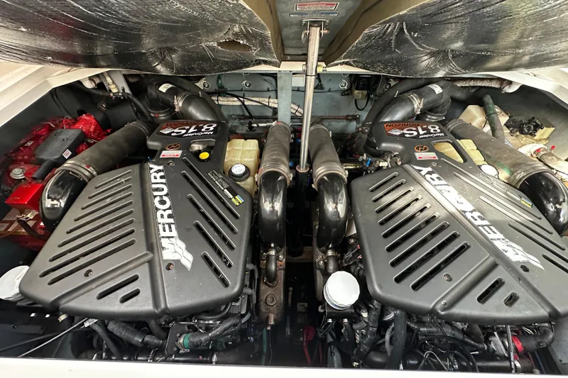 Slide: The Image of Engine compartment of a 2002 Sea Ray 340 Sundancer with twin Mercury engines. - 22