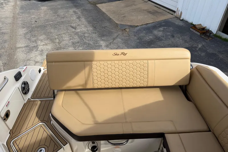 Slide: The Image of 2024 Sea Ray SDX 250 boat interior with tan seating and stylish design. - 4