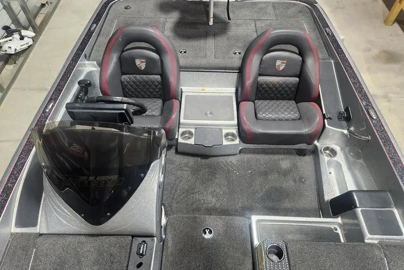 Slide: The Image of 2021 Triton 189 TrX boat interior with dual seats and steering console. - 10