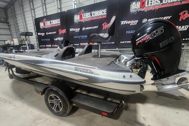 Slide: The Image of 2021 Triton 189 TrX boat with Mercury Pro XS 150 engine in showroom. - 2