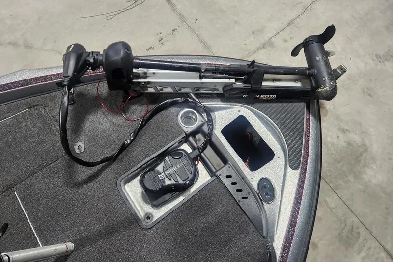 Slide: The Image of 2021 Triton 189 TrX boat with Minn Kota trolling motor on deck. - 8