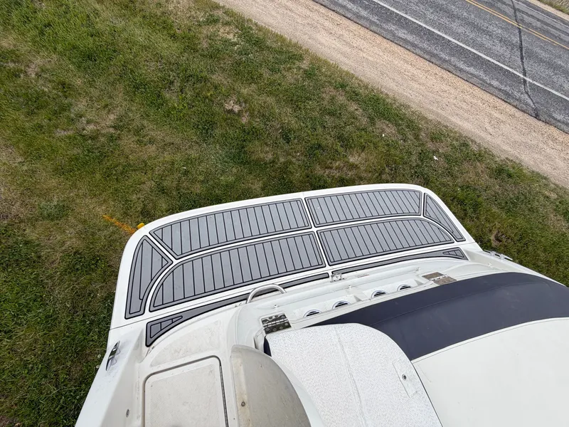 Slide: The Image of Bayliner V45 2019 boat rear on grass beside road. - 12
