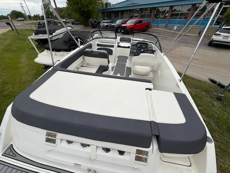 Slide: The Image of 2019 Bayliner V45 boat with spacious deck and seating area. - 13