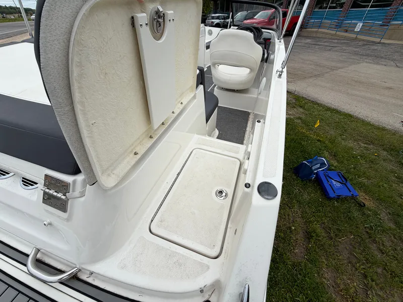 Slide: The Image of Bayliner V45 2019 boat with open storage hatch and seating area. - 14