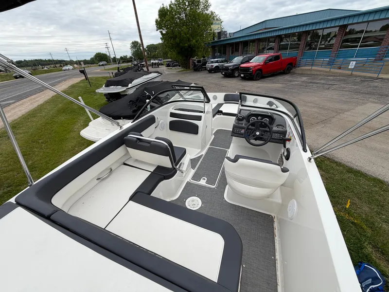 Slide: The Image of Interior of a 2019 Bayliner V45 boat, featuring helm and seating area. - 17